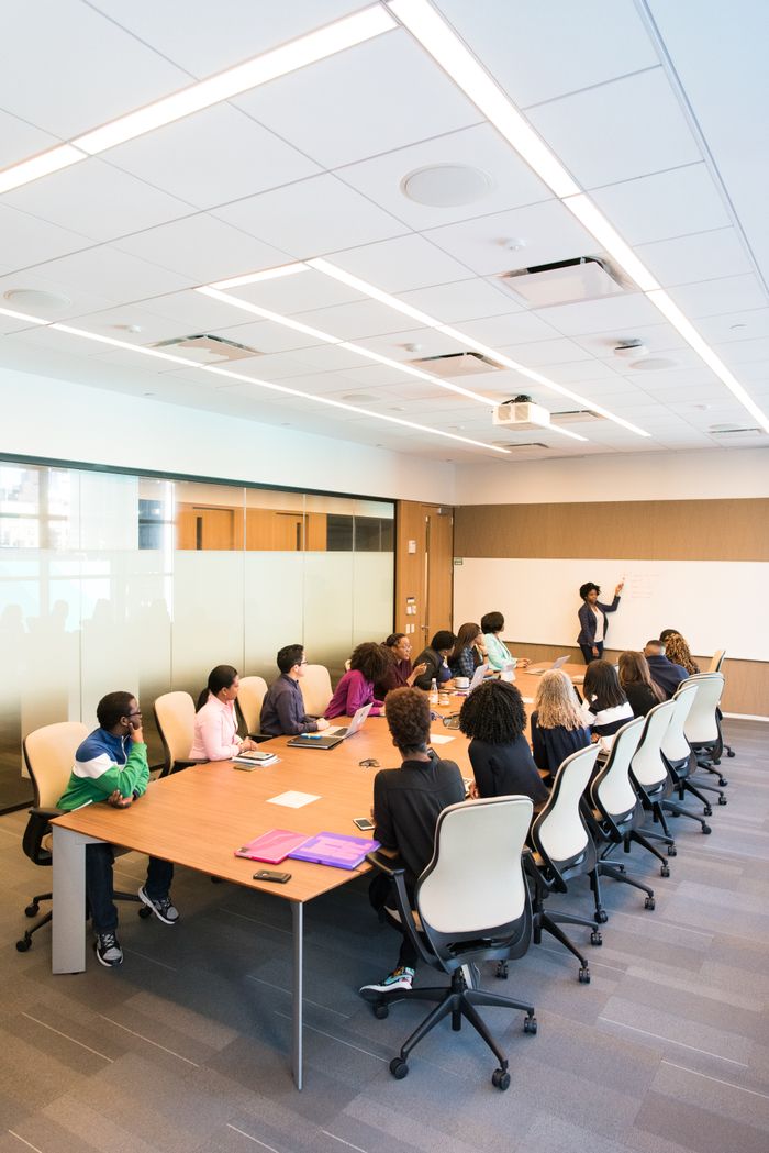 Mastering the First Impression: Your intriguing post title goes here Professional team engaged in a collaborative boardroom meeting with a presentation in progress.